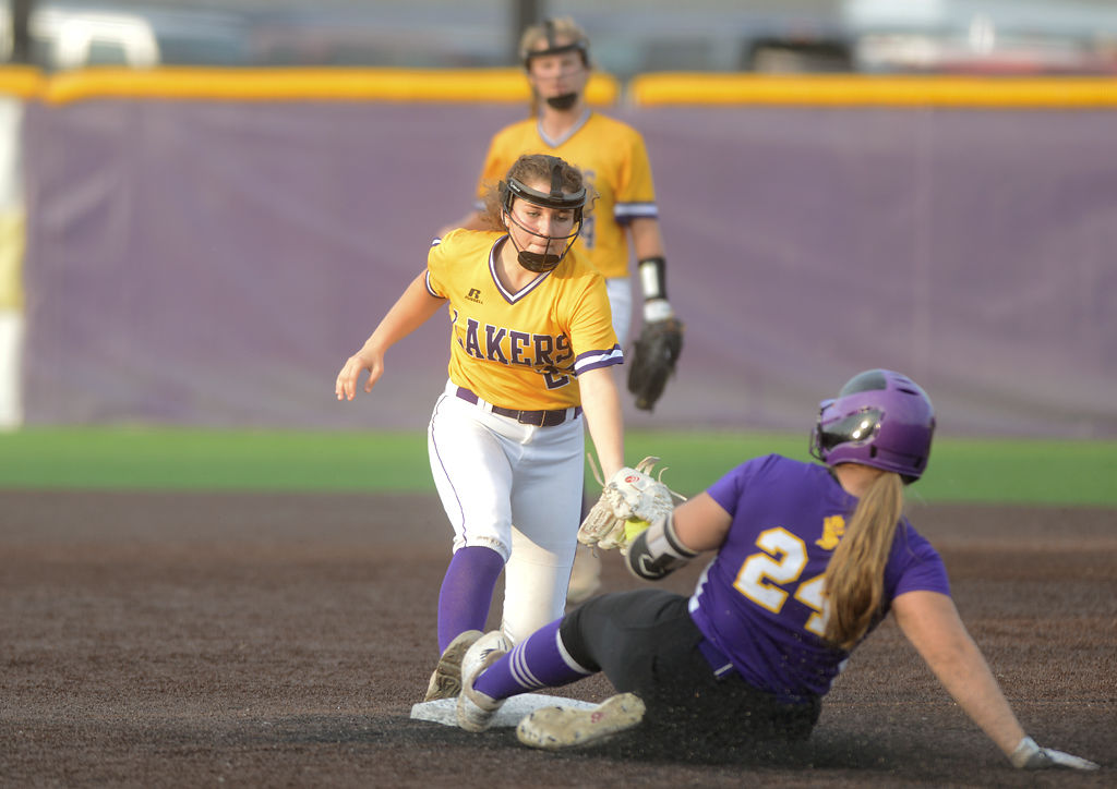 Camdenton Laker's Skylar Sederwall attempts to tag out Hickman Kewpie's Athena Wheeler